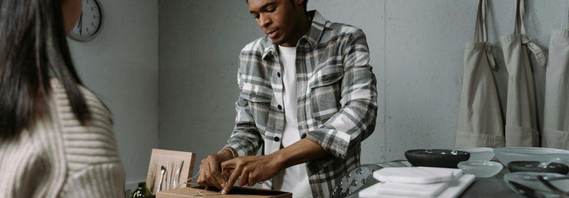 Professional movers packing boxes and furniture into a moving truck for relocation services in Kenya.