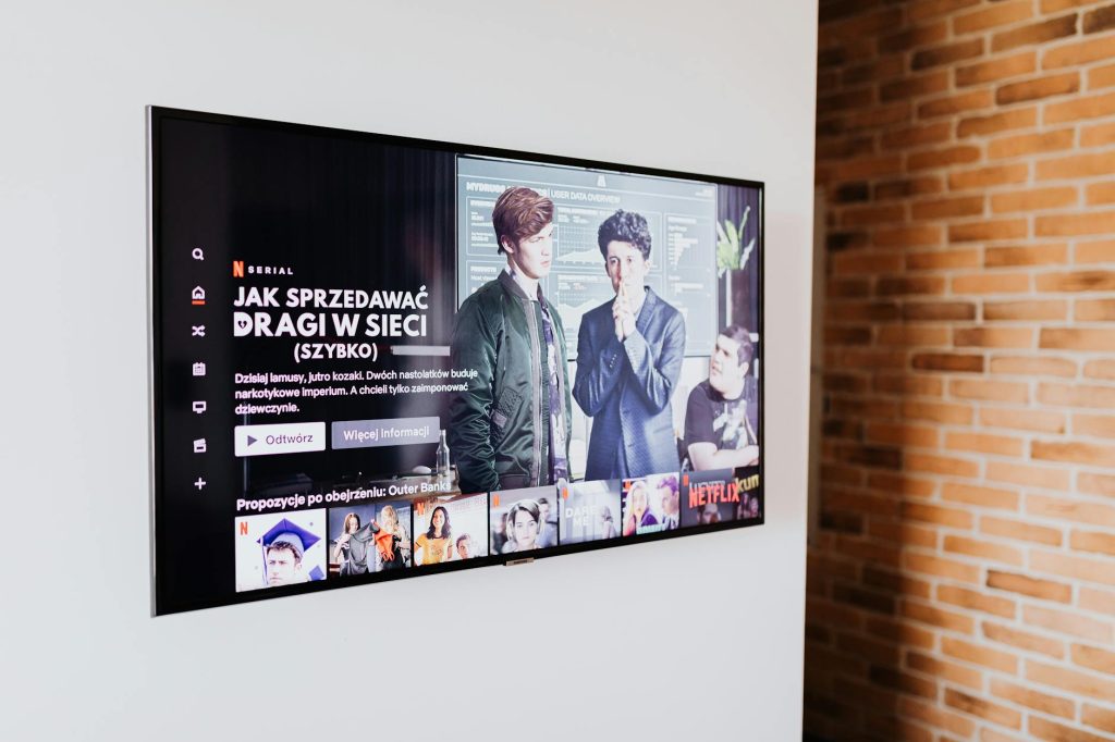 A professional installing a TV wall bracket in a Nairobi home.