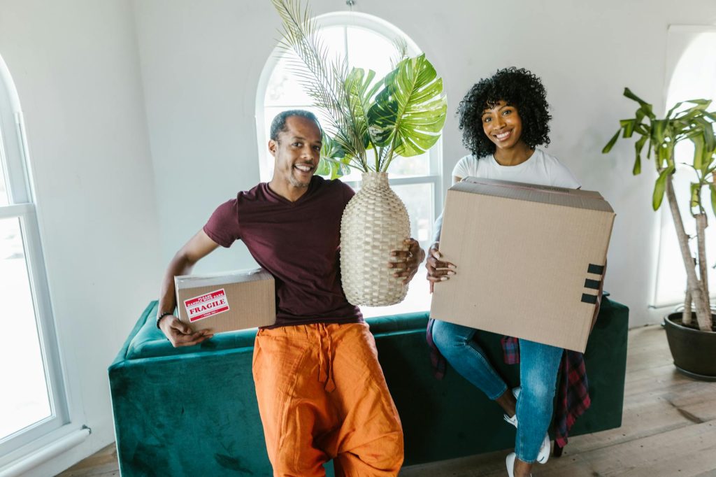 Top-rated movers in Athi River pack and load furniture into a moving truck.