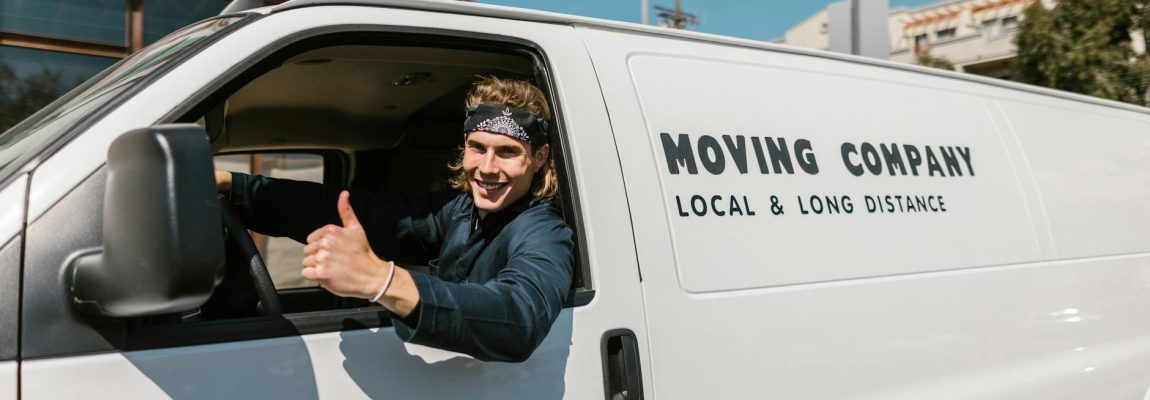 A friendly family moving team loads furniture and boxes into a truck in Kenya, ready for relocation.