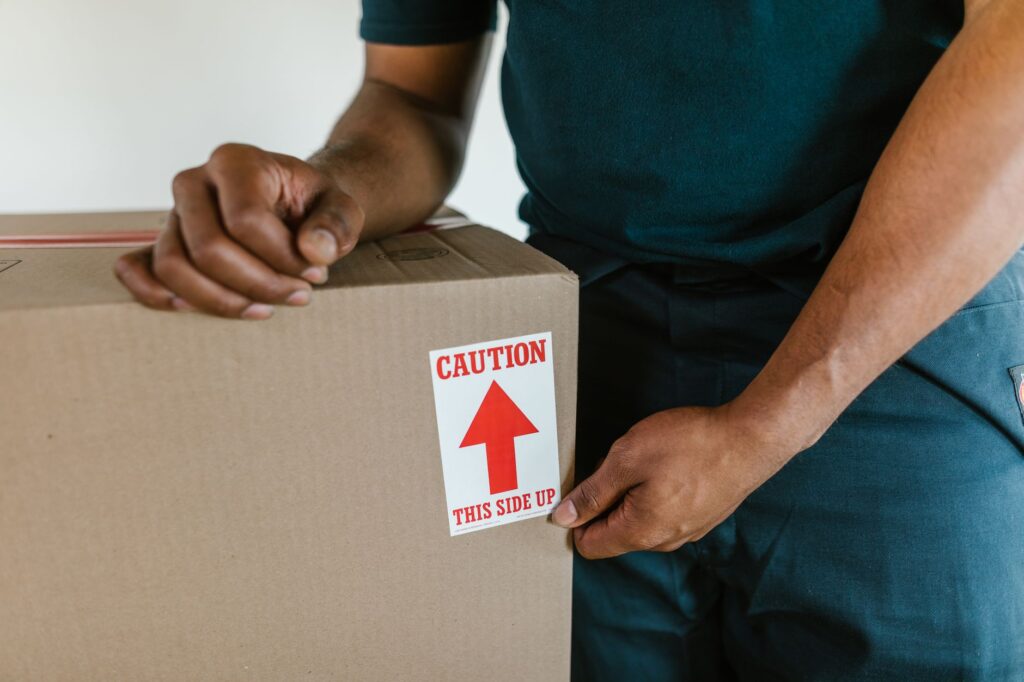 Affordable movers in Kilimani loading furniture into a moving truck.