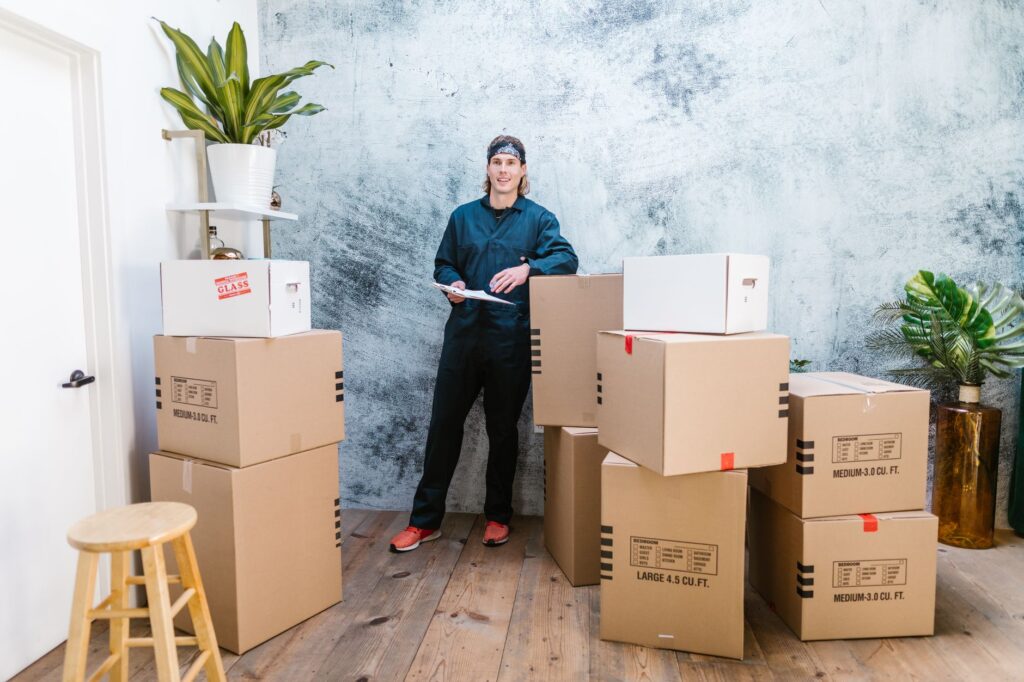 A professional moving team in Kenya loads furniture onto a truck for house and office relocation.
