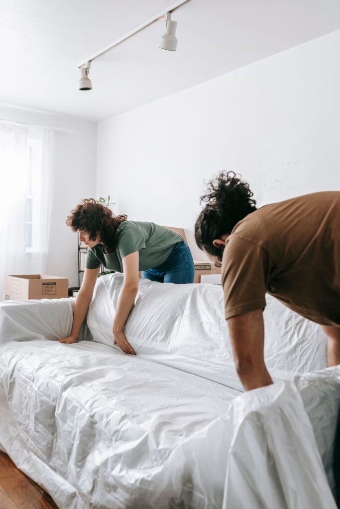 Professional house movers in Syokimau carrying furniture during relocation.
