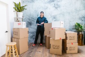A professional moving team in Parklands loads furniture into a moving truck for a house or office relocation.