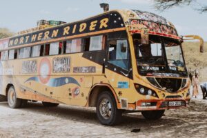 A trusted mover loading furniture into a truck during a relocation service in Kenya.