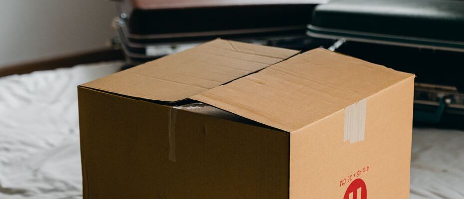 A team from Good Life Movers loads furniture into a moving truck for a three-bedroom house relocation in Kenya.