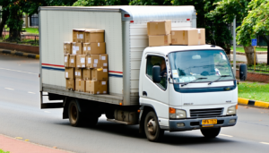 Professional movers in Nairobi, Kenya, safely loading boxes into a truck for a fast relocation.