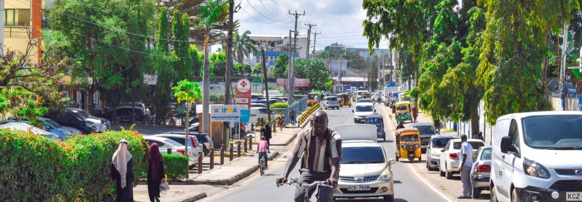 Two movers carry furniture along Mombasa Road near Syokimau, Kenya.