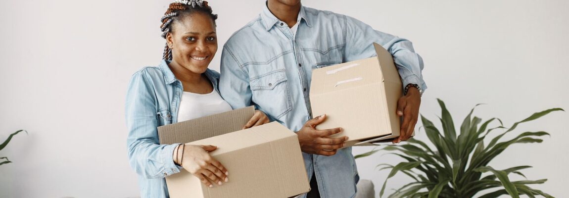 Professional movers carrying furniture out of a house in Syokimau estate.