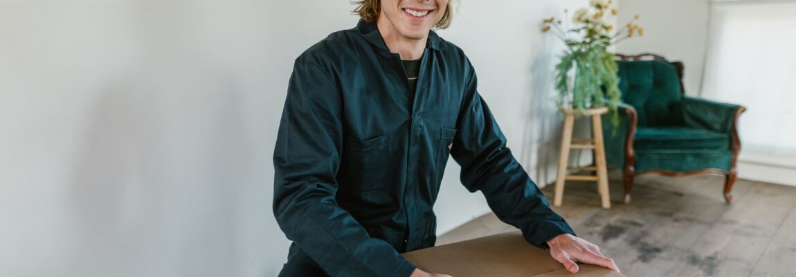 Professional moving crew carrying residential furniture out of a house in Nairobi.