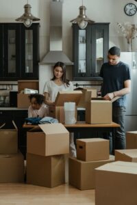 House movers packing boxes during a residential move in Syokimau.